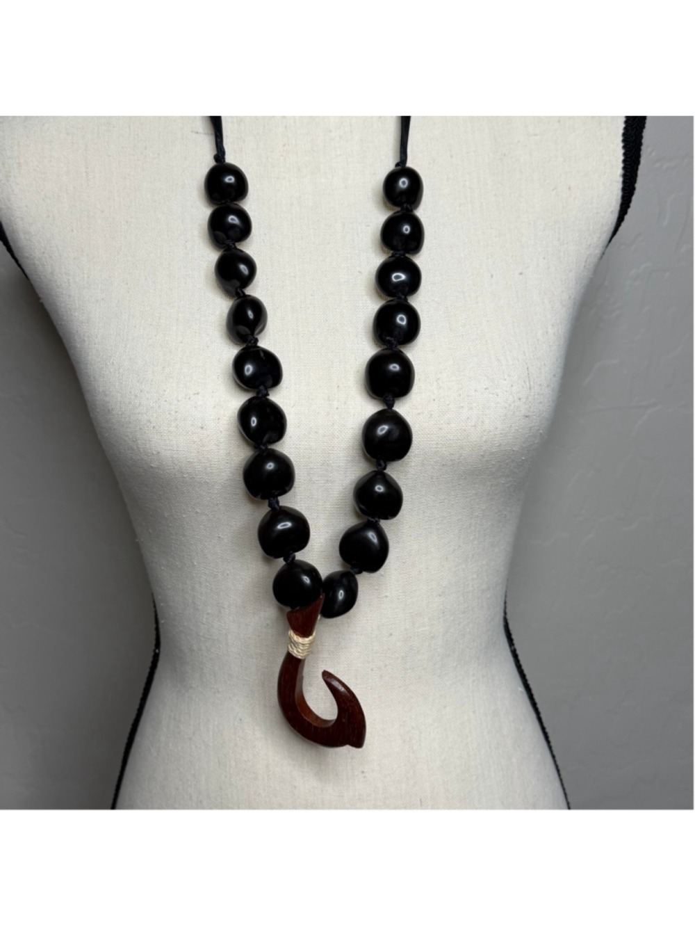 black kukui nut lei with a wooden fish hook pendant - Picture 3 of 4